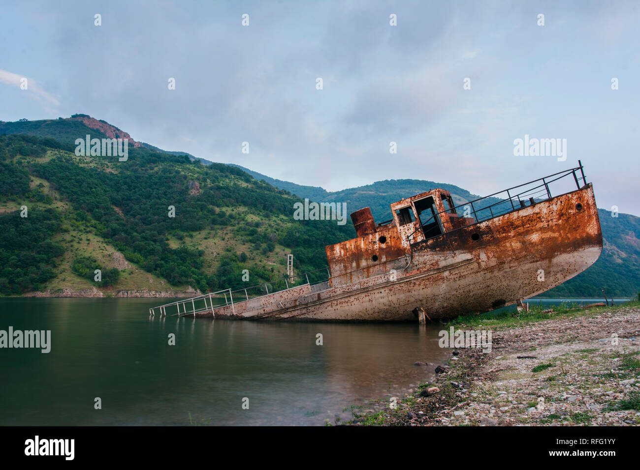old rusty abandoned ship in Studen Kladenec dam, Bulgaria Stock Photo
