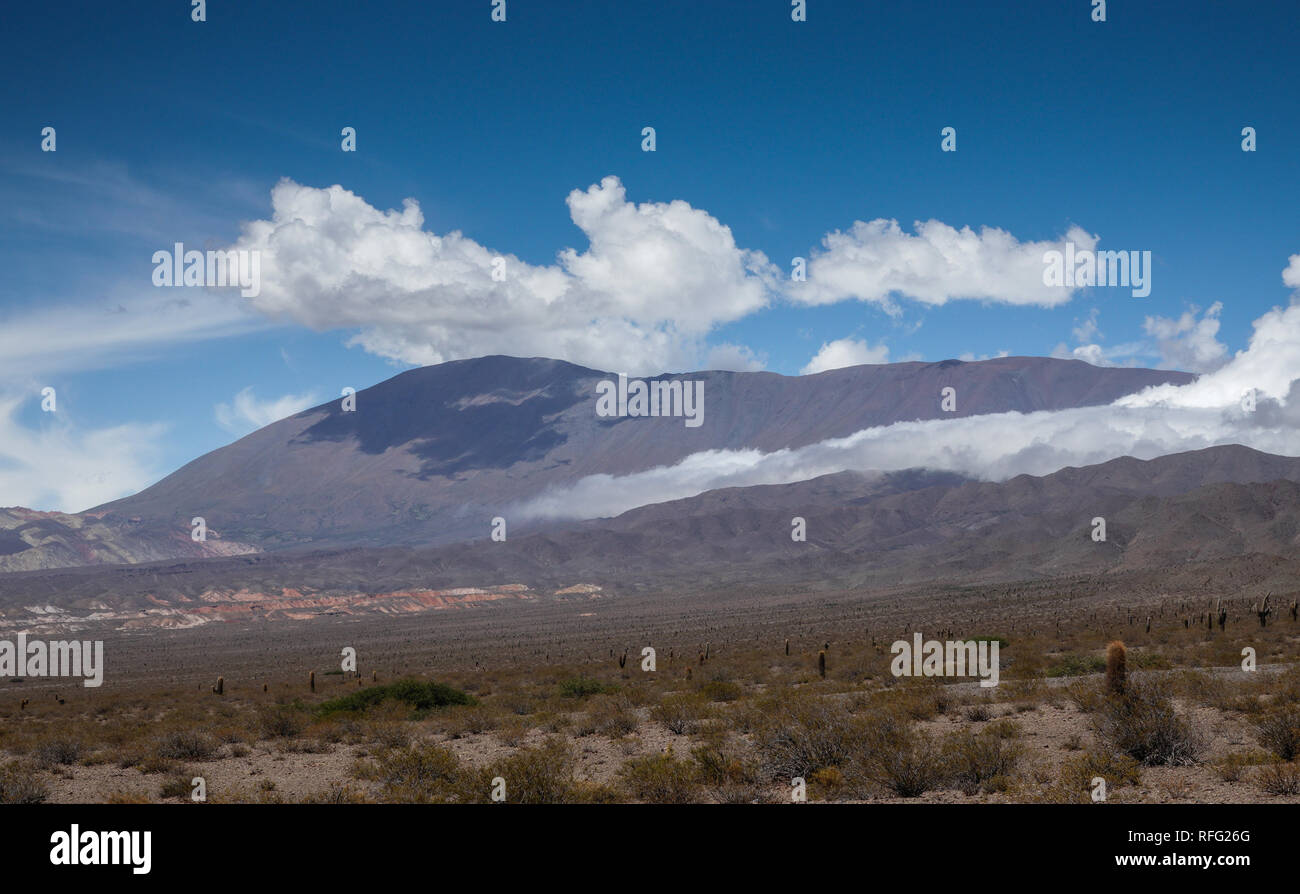 High plateau on the Recta de Tintin in the Los Cardones National Park, northern Argentina. Cloud 'spilling' down a ravine. Stock Photo