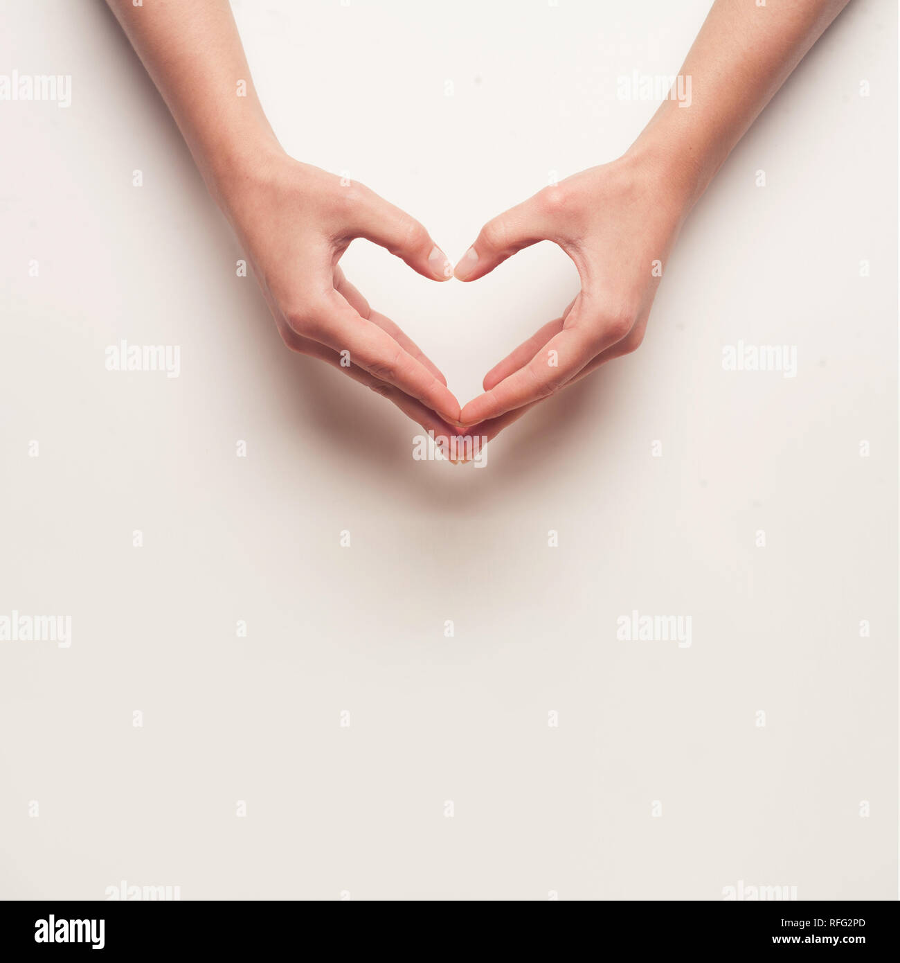 Woman shows finger heart hi-res stock photography and images - Alamy