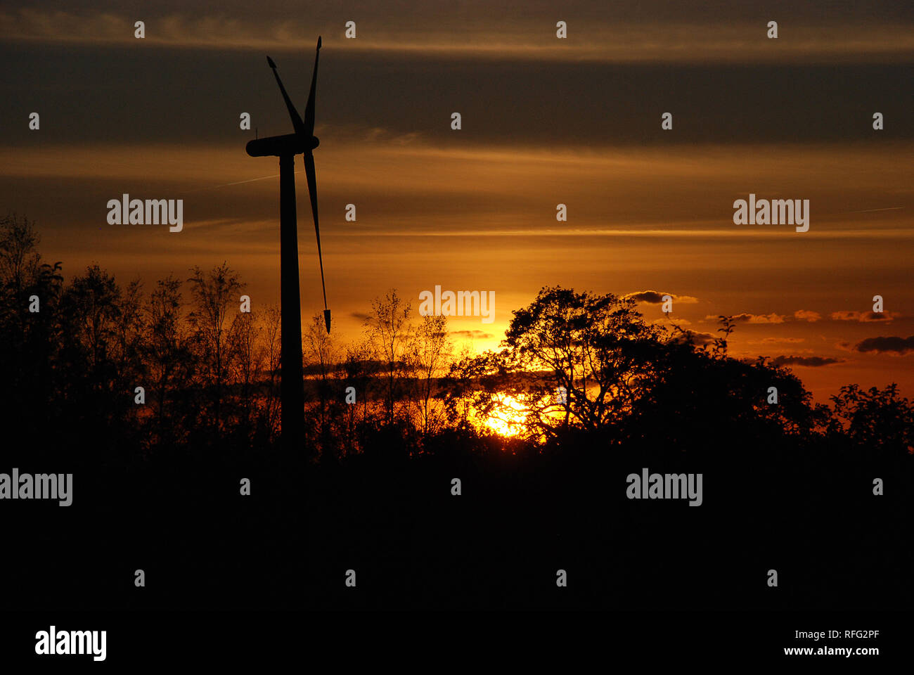 Wind turbine during a sunset Stock Photo