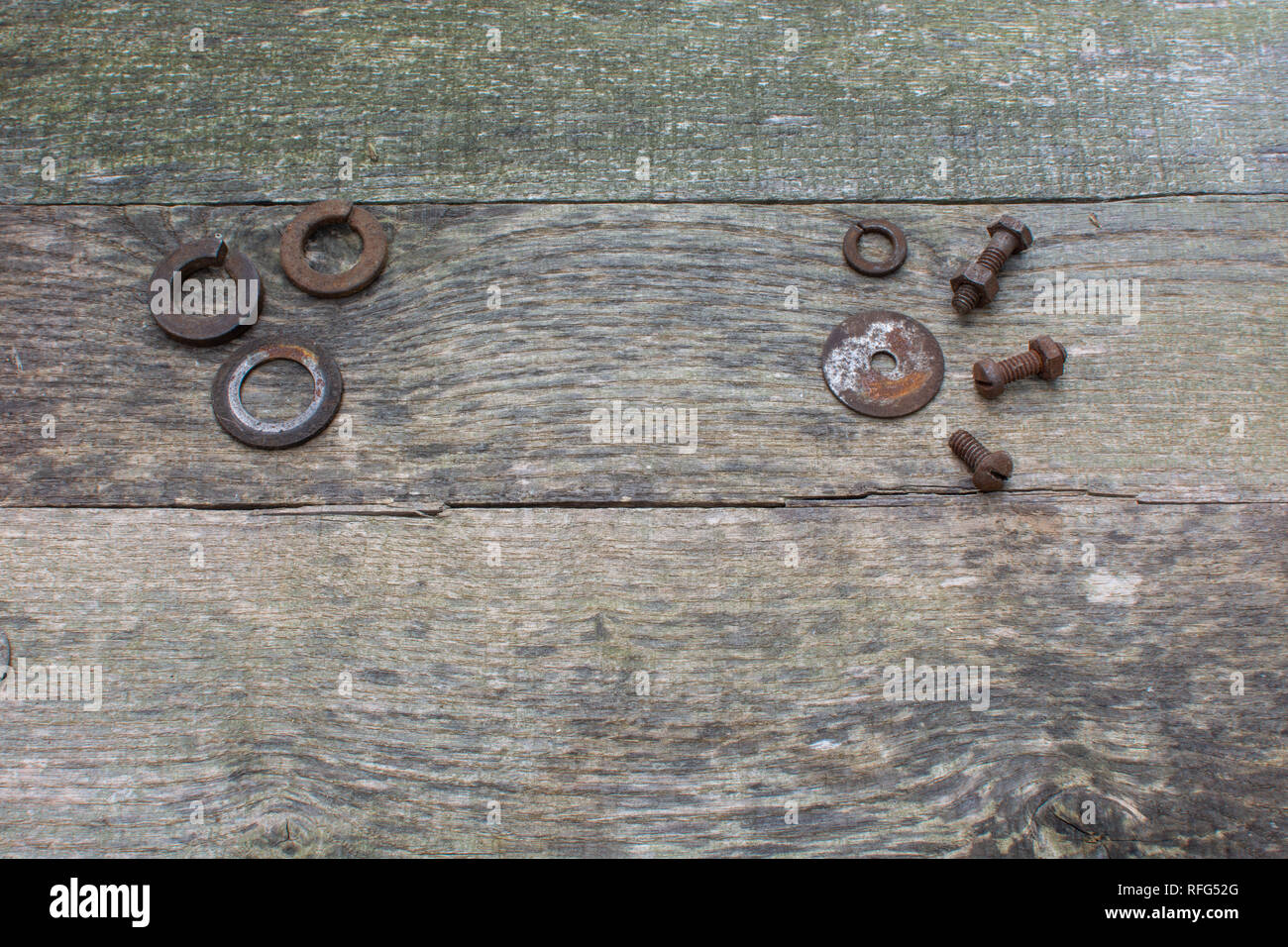 Rusty Washers Weathered pallet wood boards as a background with 3 rusty washers ...