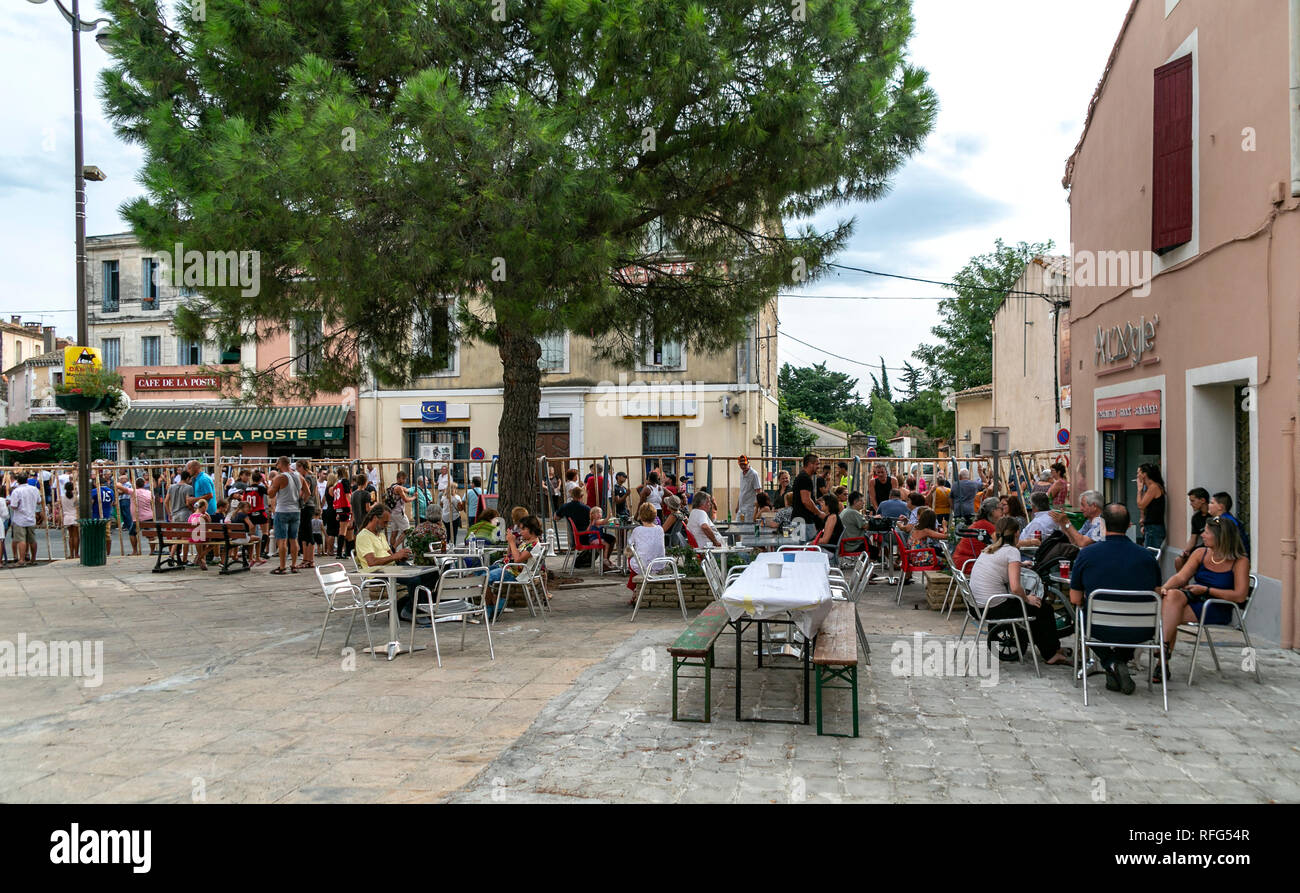 Spectators waiting behind barriers for the annual bull running fete, Saint Gilles, Gard, France Stock Photo