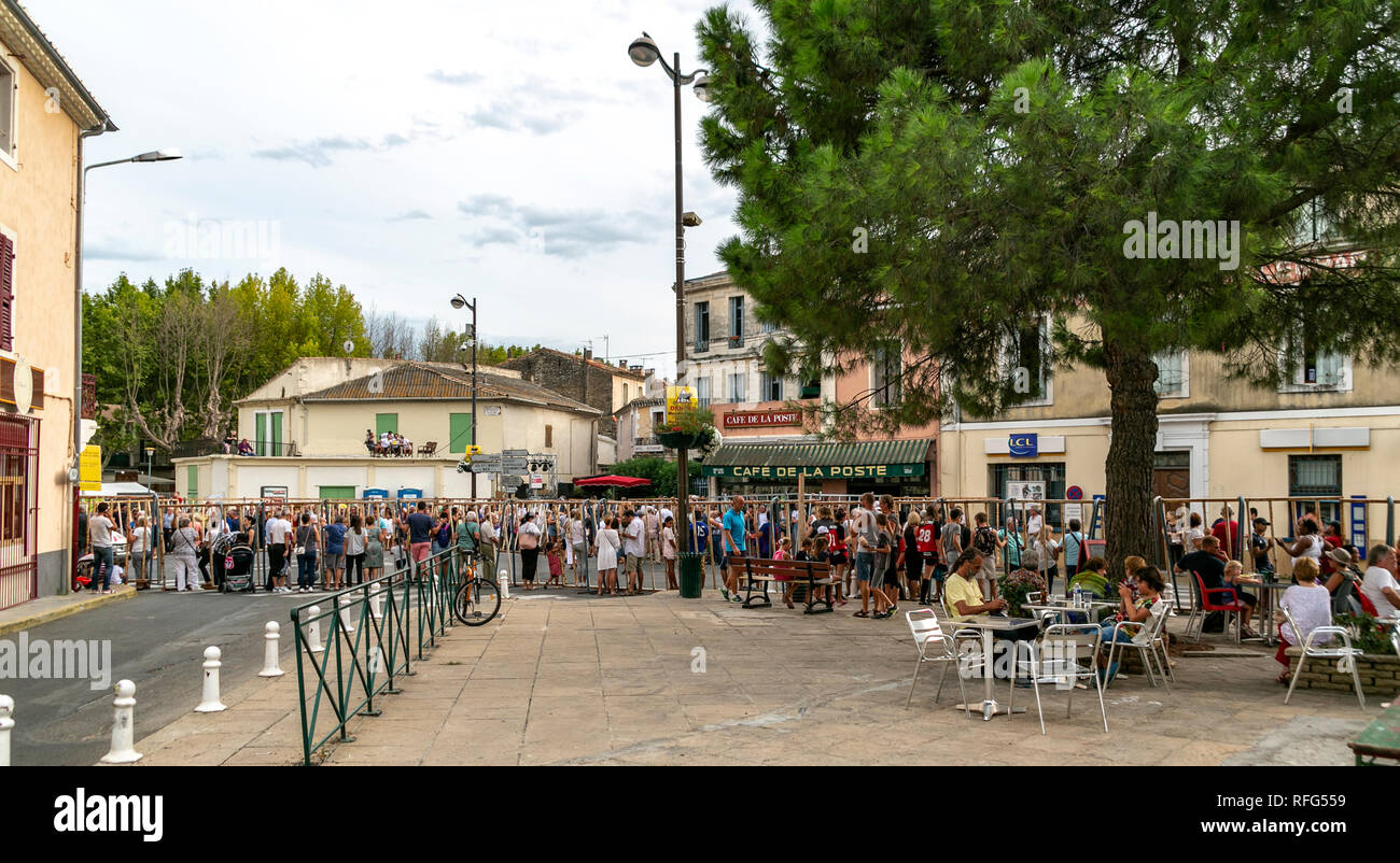 Spectators waiting behind barriers for the annual bull running fete, Saint Gilles, Gard, France Stock Photo