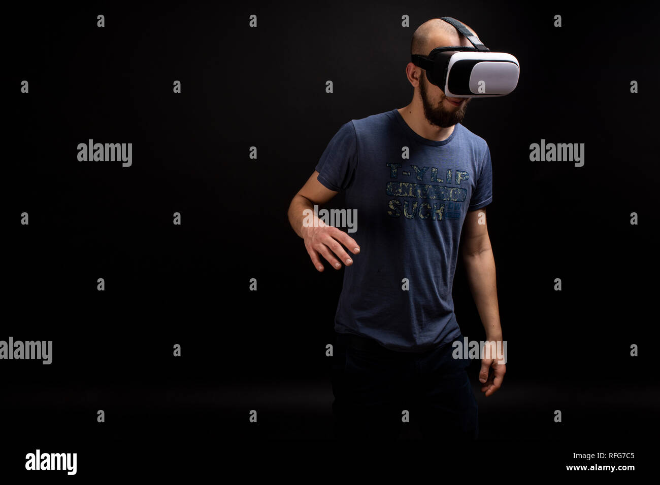 Male model using VR gear interacting while using device. Virtual game simulation. Copy space available Stock Photo
