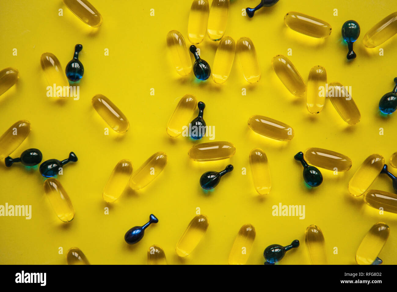 Capsule background with Omega 3, hyaluronic acid. Caring for the health