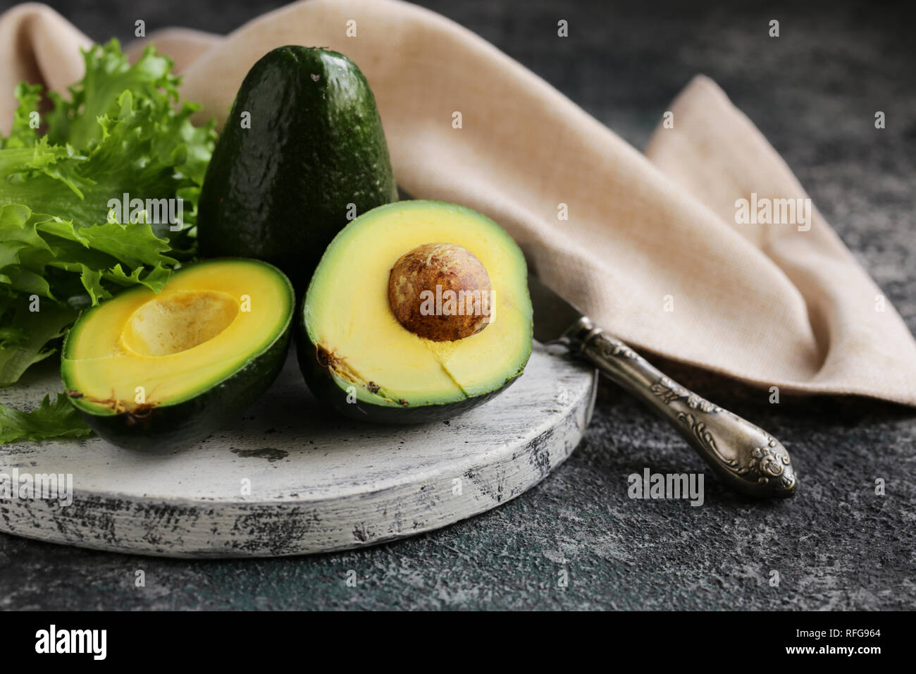 fresh organic avocado on a wooden board Stock Photo - Alamy