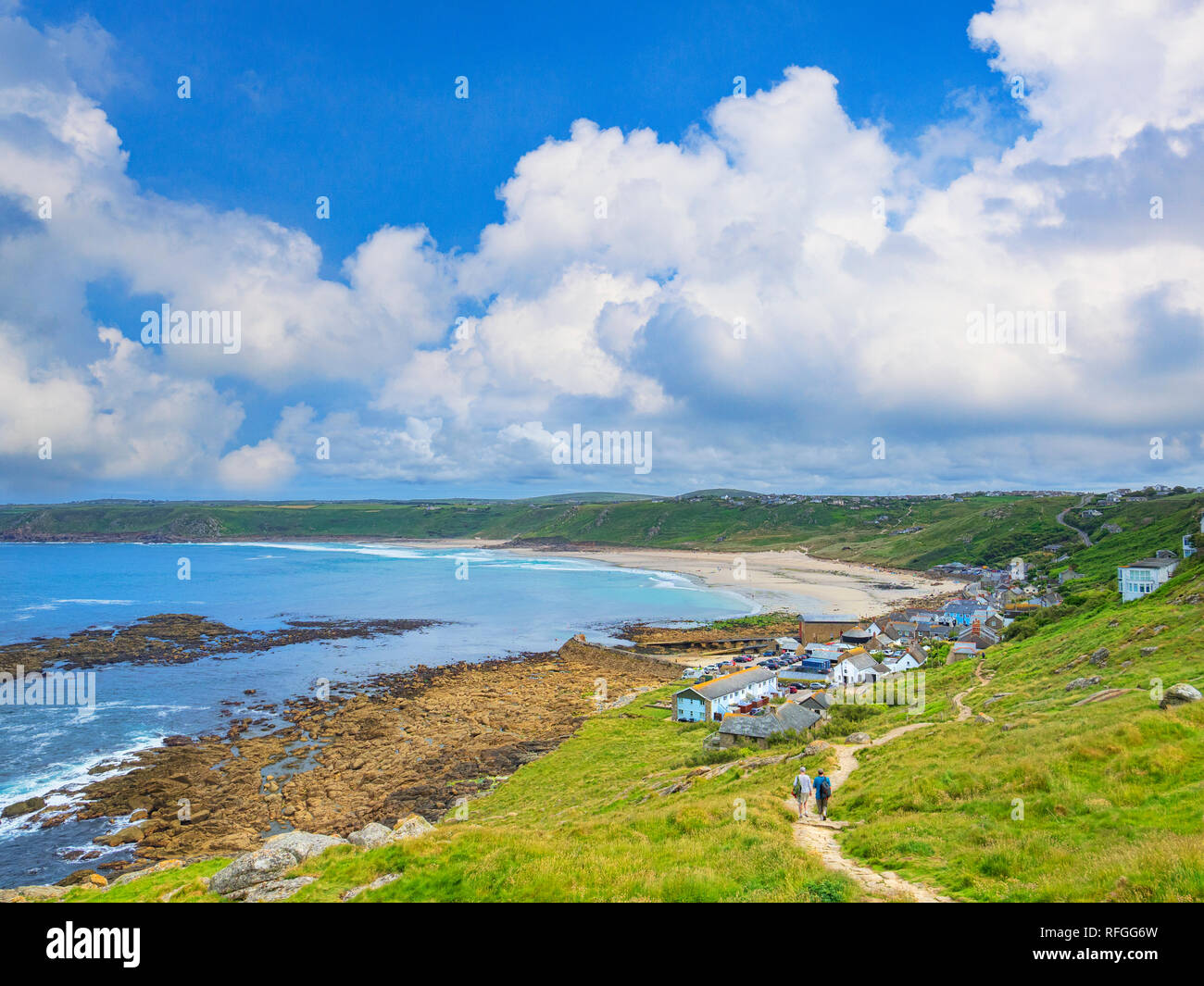 15 June 2018: Sennen Cove, Cornwall, UK - The South West Coast Path winds its way into Sennen Cove village. Stock Photo