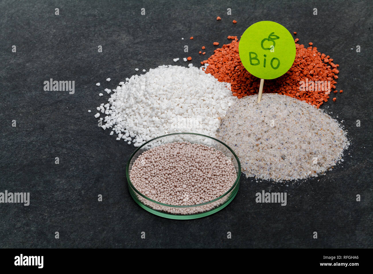 Garden background with mineral fertilizers balls. Complex mineral