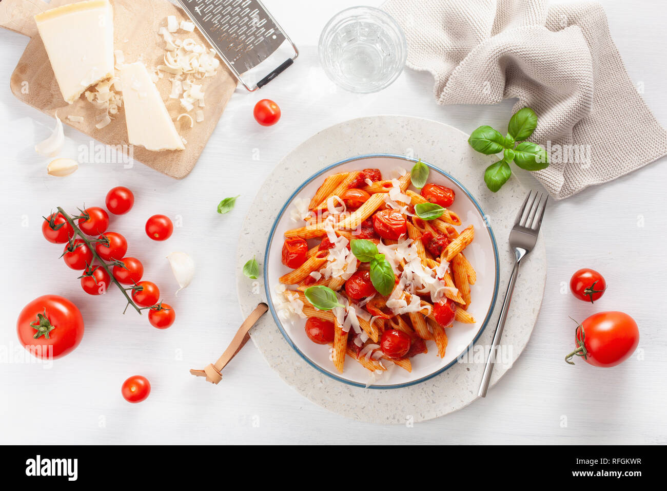 italian penne pasta with tomatoes parmesan basil Stock Photo - Alamy