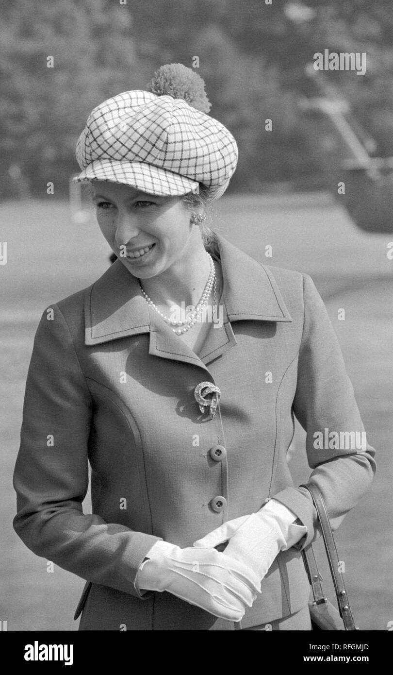 Her elegant two-piece outfit is completed by this fetching design in headwear - a red and white check cap with matching pompom - as Princess Anne visits the Marjorie McClure Group of Riding for the Disabled Association at Chislehurst, Kent. Stock Photo