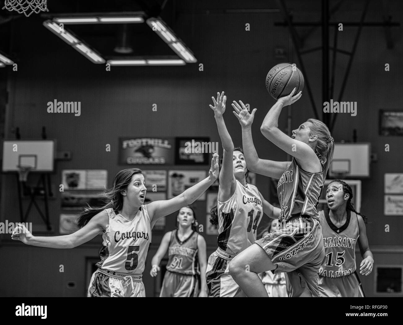 Basketball action with Pleasant Valley vs. Foothill High School in Palo Cedro, California. Stock Photo