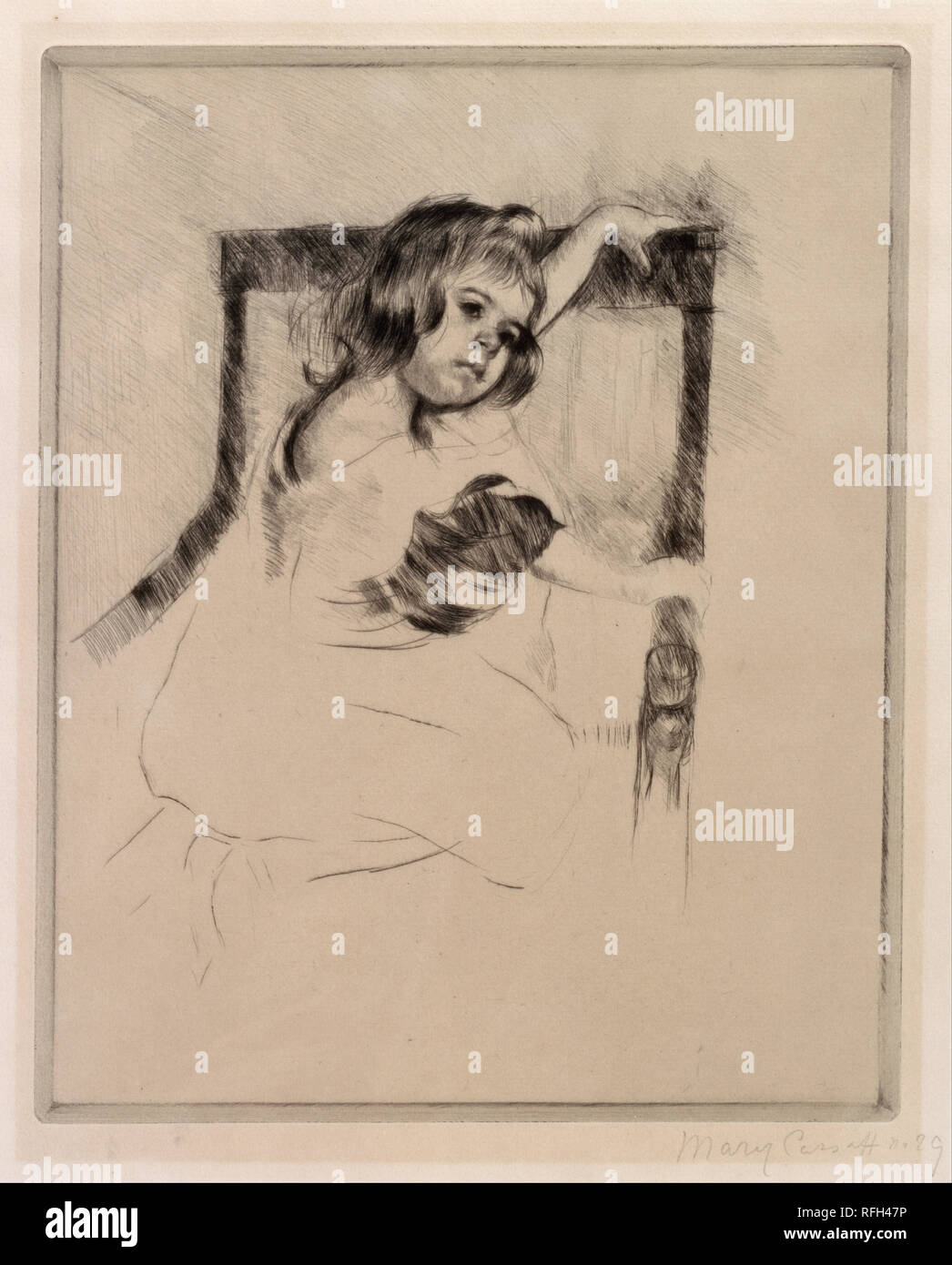 Kneeling in an Armchair. Date/Period: Ca. 1903. Print. Drypoint on paper Drypoint on paper. Height: 240.03 mm (9.45 in); Width: 198.12 mm (7.80 in). Author: Mary Cassatt. Stock Photo