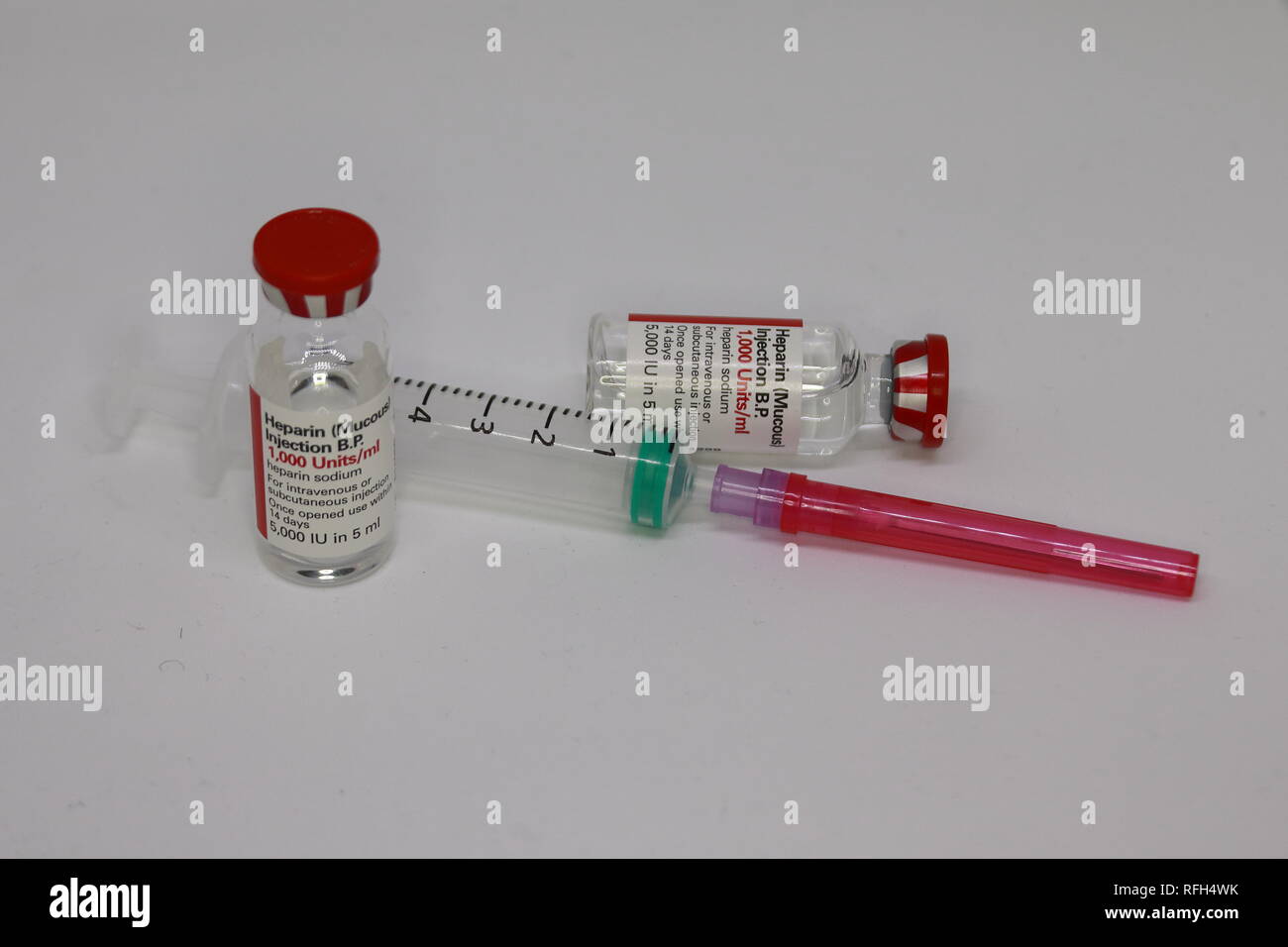 Heparin vials with a syringe and drawing up needle Stock Photo