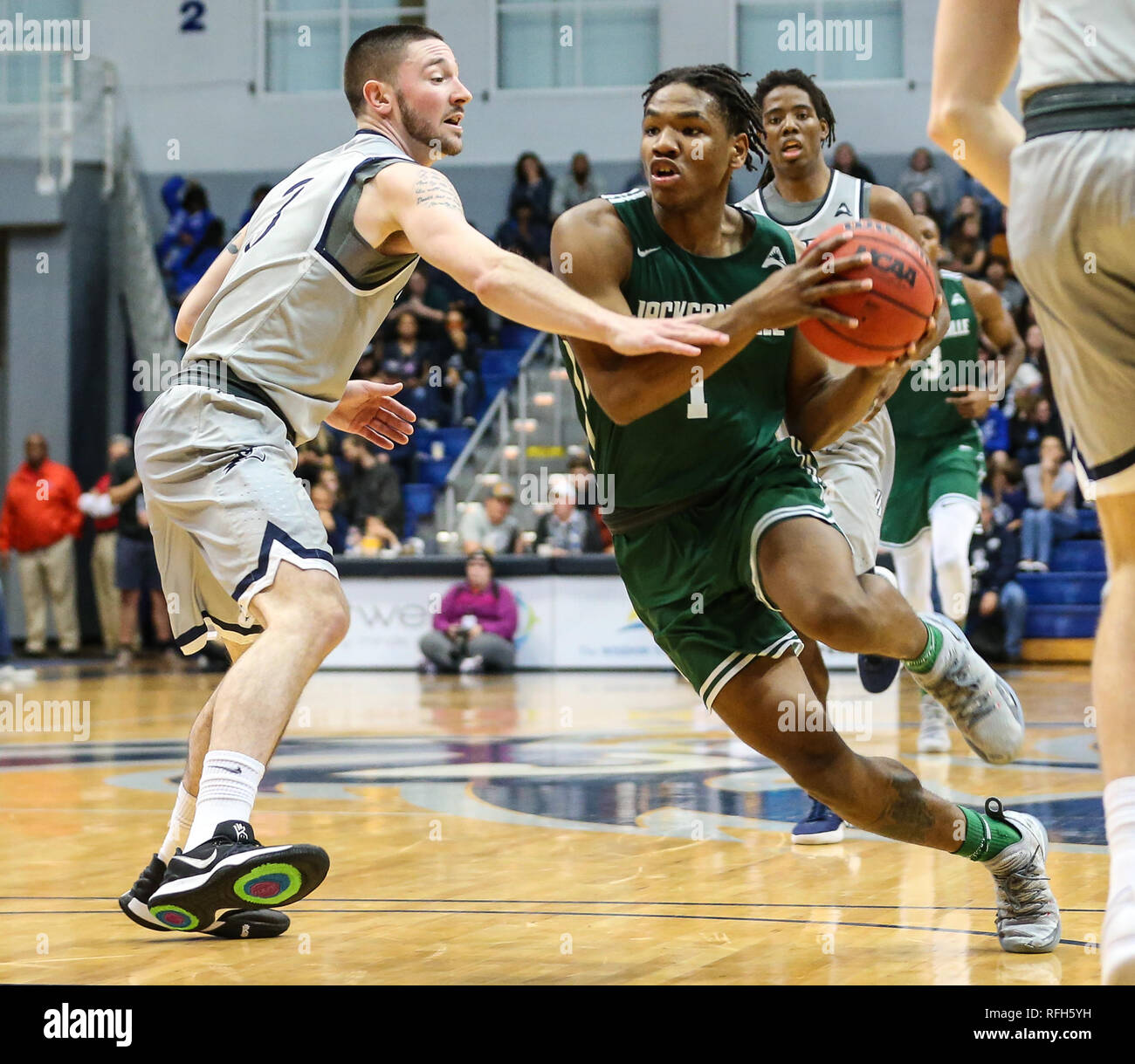 Jacksonville Dolphins guard JD Notae (1) defended by North Florida