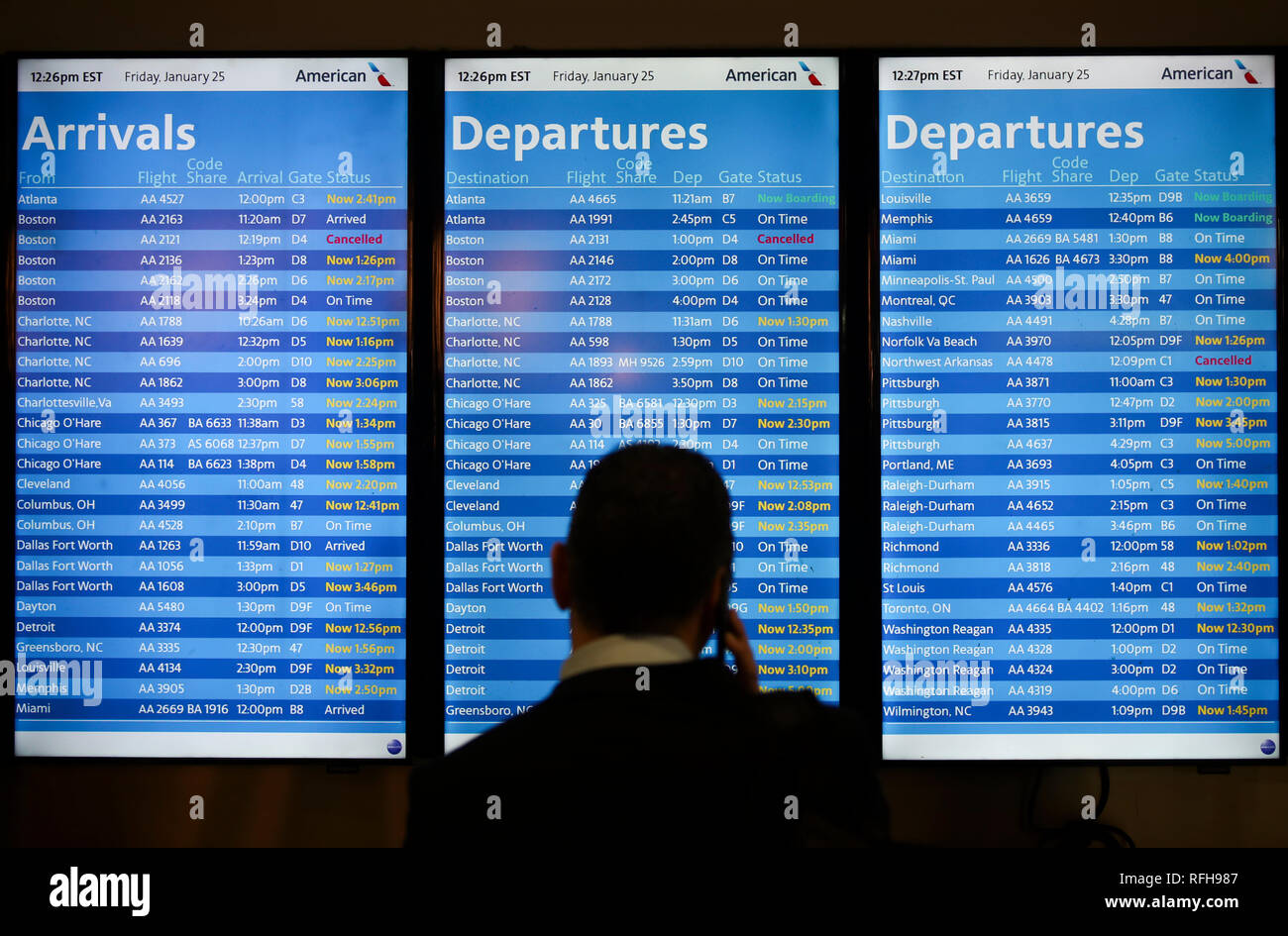 New York, USA. 25th Jan, 2019. Flight monitors show the status of arrivals and departures with many flights delayed at the LaGuardia Airport in New York, the United States, on Jan. 25, 2019. The U.S. Federal Aviation Administration on Friday halted flights bound for New York City's LaGuardia Airport, due to staff shortage caused by the historic government shutdown. Credit: Wang Ying/Xinhua/Alamy Live News Stock Photo