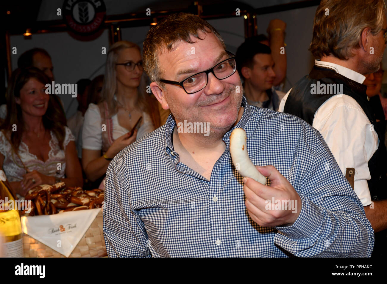 Going, Austria. 25th Jan, 2019. Elton's a Weißwurst at the Weißwurst party at Stanglwirt. After today's downhill race at the Hahnenkamm race, the celebrities celebrate until late into the night. Credit: Felix Hörhager/dpa/Alamy Live News Stock Photo