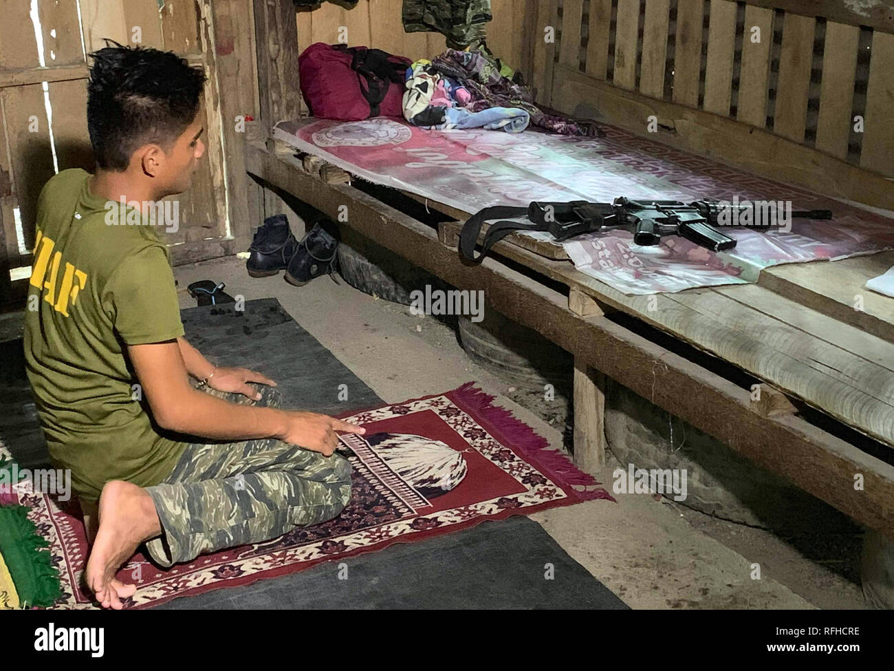 Maguindanao, Philippines. 26th January 2019.  Filipino Muslim rebels pray inside their detachment in Sultan Kudarat town in Maguindanao in the southern Philippines, Saturday, January 26, 2019, a day after the Comelec announced Bangsamoro Organic Law (BOL) was “deemed ratified,” as officials released figures showing that more than 1.5 million registered voters had cast “yes” ballots for the law’s ratification versus nearly 200,000 who had voted against it.  The law aims to give the impoverished south an expanded autonomous area. Credit: Jeoffrey Maitem/Alamy Live News Stock Photo