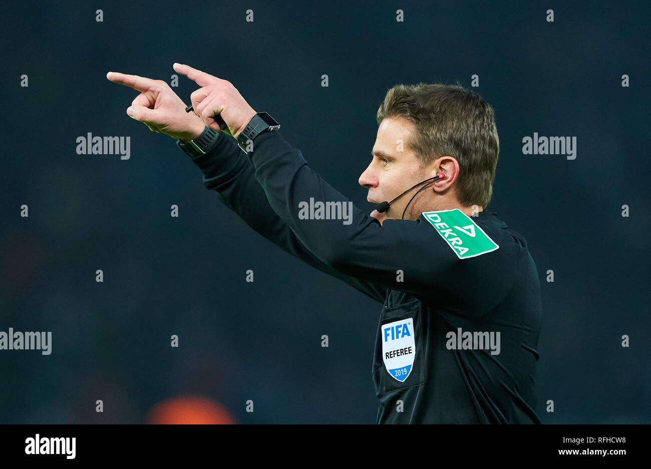 Berlin, Germant. 25th January 2019. Referee Felix BRYCH with whistle,  gestures, shows, watch, individual action, Video assist, videorecord,  videoreferee, videotape, sign, hand to ear, call, radio, ask, video,  inquiry, video chirp, repeat,