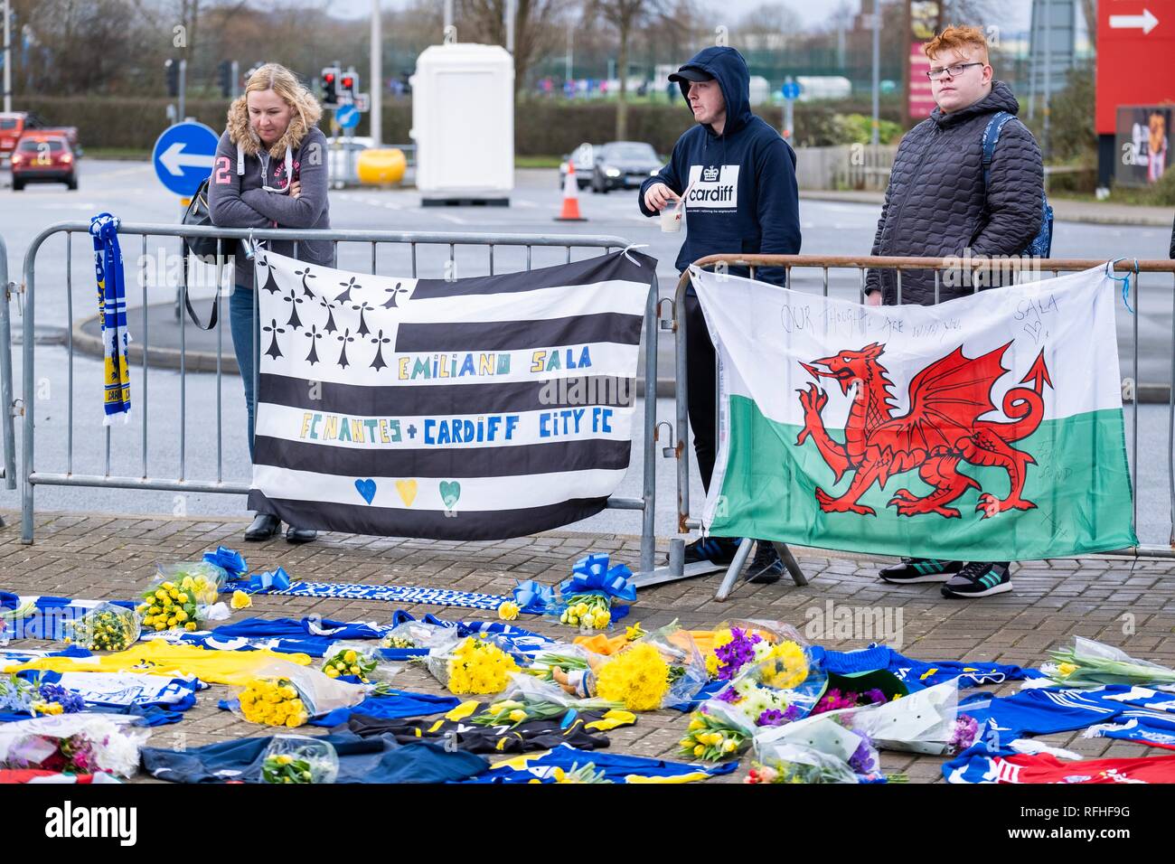 Cardiff, Wales, UK. 26th January 2019.  Tributes are being left by members of the public to footballer Emiliano Sala outside Cardiff City Football stadium on Saturday, January 26, 2019, following the disappearance of an aircraft over the English Channel earlier this week which Sala was on board. Credit: Christopher Middleton/Alamy Live News Stock Photo