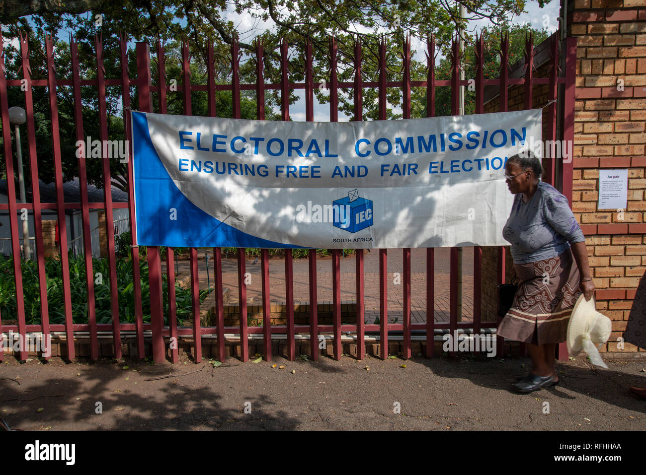 Johannesburg, South Africa. 26th Jan, 2019. A woman passes an election sign after leaving a voting registration site in Linden, Johannesburg, Saturday afternoon. It's the final weekend to register to vote in South Africa's 2019 general elections. Credit: Eva-Lotta Jansson/Alamy Live News Stock Photo