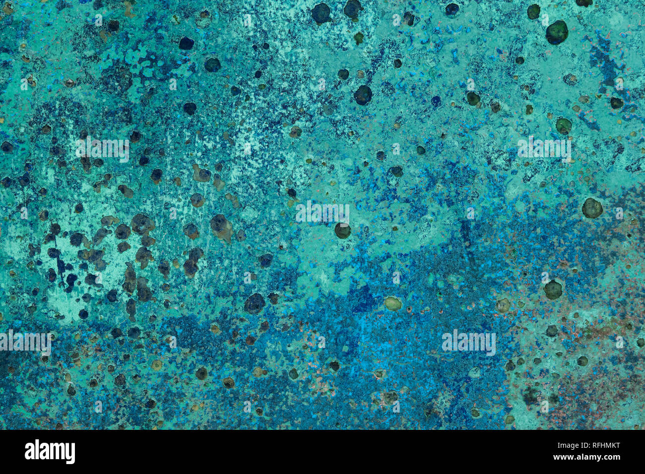 Metal corrosion patterns on an old turquoise painted boat, Ireland Stock Photo
