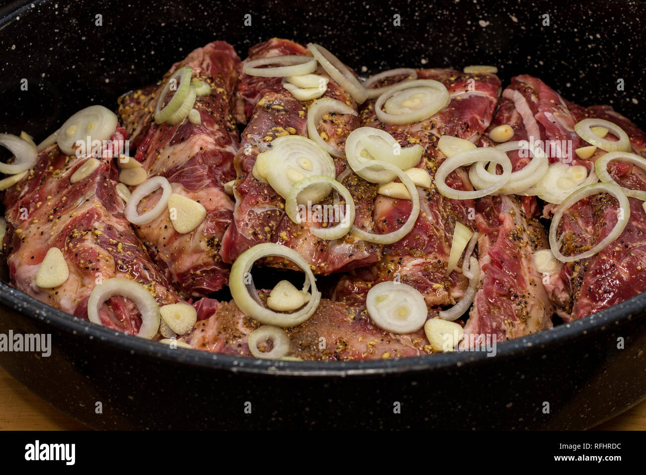 A big pan of beef ribs ready for the oven. Stock Photo