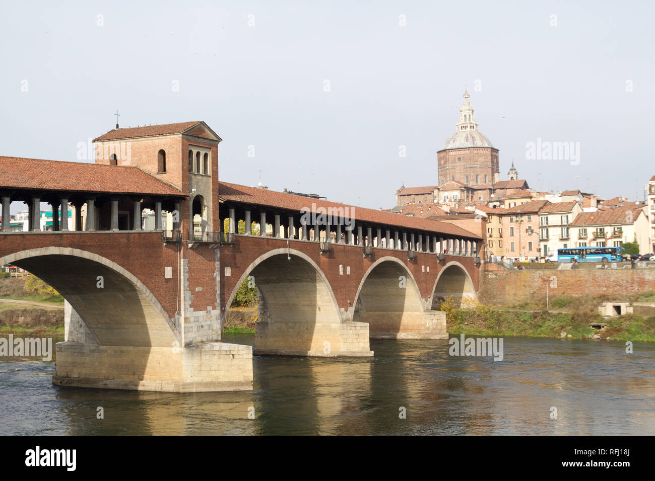 The Ponte Coperto ('covered bridge') or the Ponte Vecchio ('Old Bridge') is a brick and stone arch bridge over the Ticino River in Pavia, Italy. Stock Photo