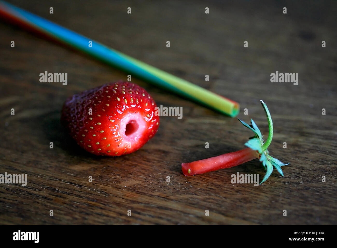A plastic straw used to hull or remove the stalk from a strawberry Stock Photo Alamy