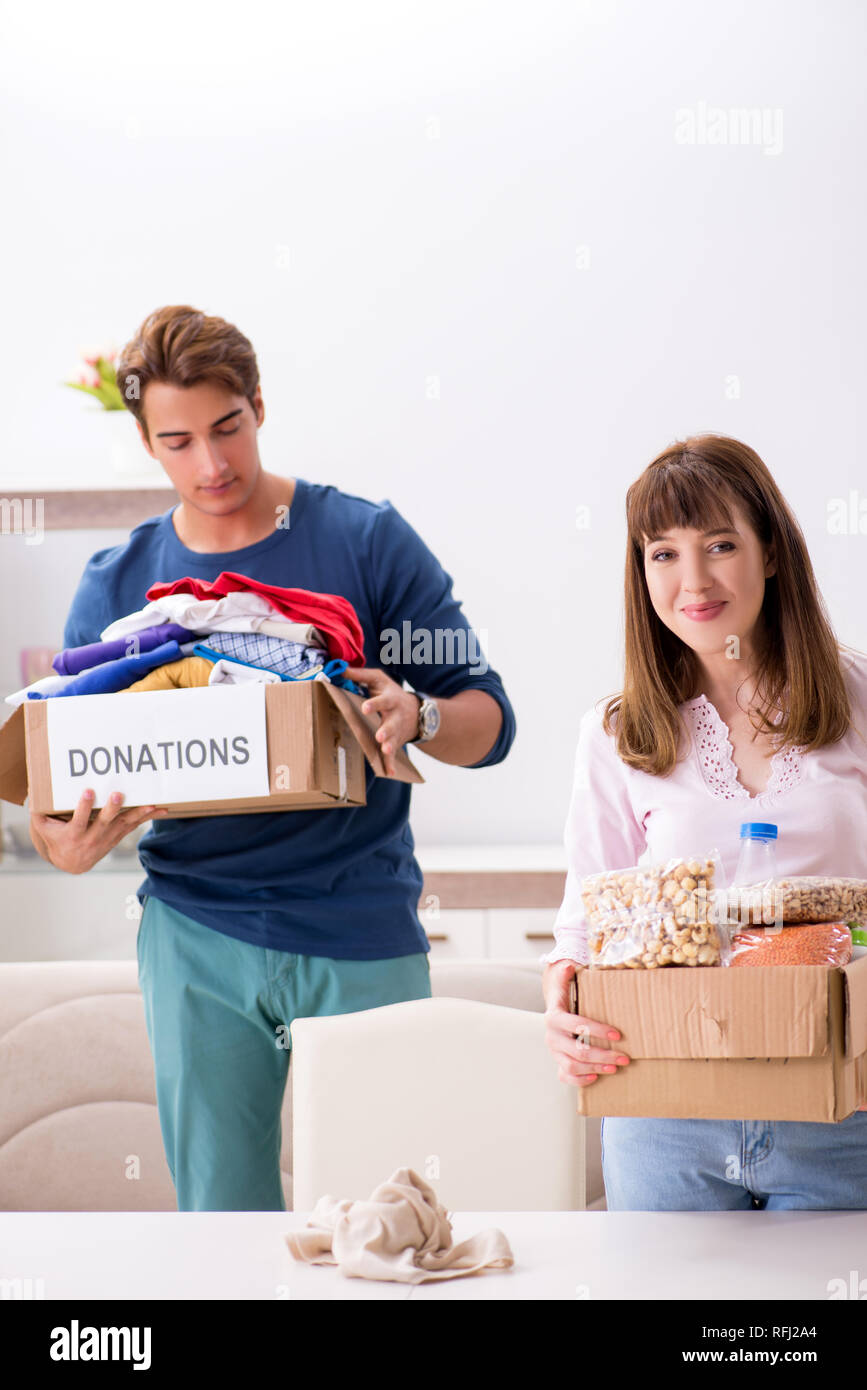 Concept of charity with donated clothing Stock Photo Alamy