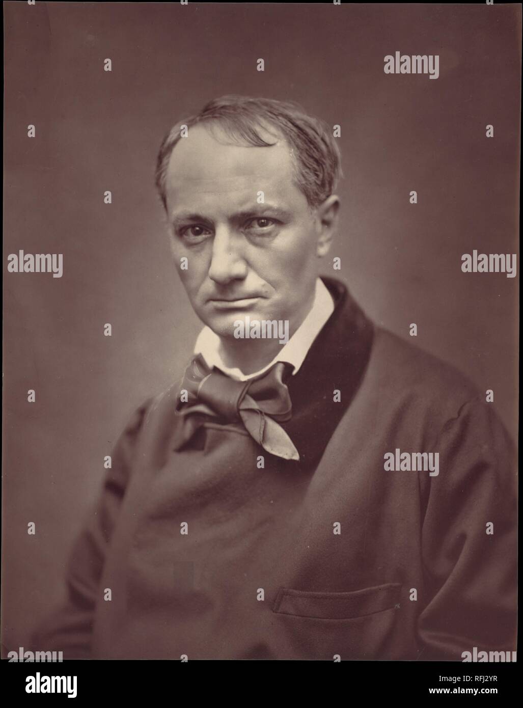 Charles Baudelaire. Artist: Étienne Carjat (French, Fareins 1828-1906 Paris). Printer: Goupil et Cie (French, active 1850-84). Date: ca. 1863.  Although the great French poet Baudelaire famously declared photography to be "the refuge of every would-be painter, every painter too ill-endowed or too lazy to complete his studies," he posed before the camera several times. This striking portrait of the brooding poet by Carjat is perhaps the best known, for it was published in the widely distributed series entitled Galerie contemporaine, littéraire, artistique.  The Galerie contemporaine is a high p Stock Photo