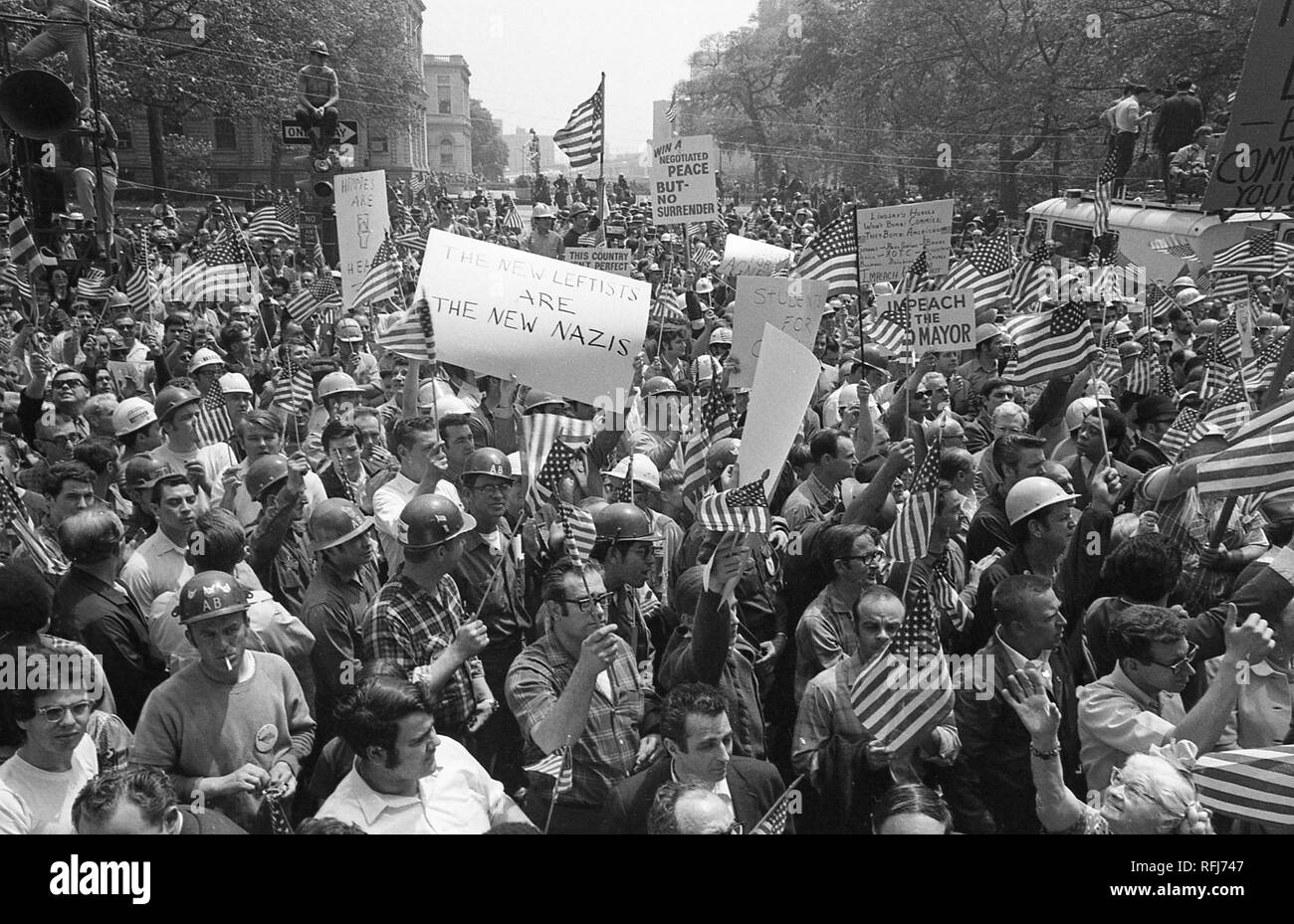 Demonstrators march and hold banners while participating in protests related to the anti-Vietnam War Hard Hat Riot, New York City, New York, May 1970. () Stock Photo