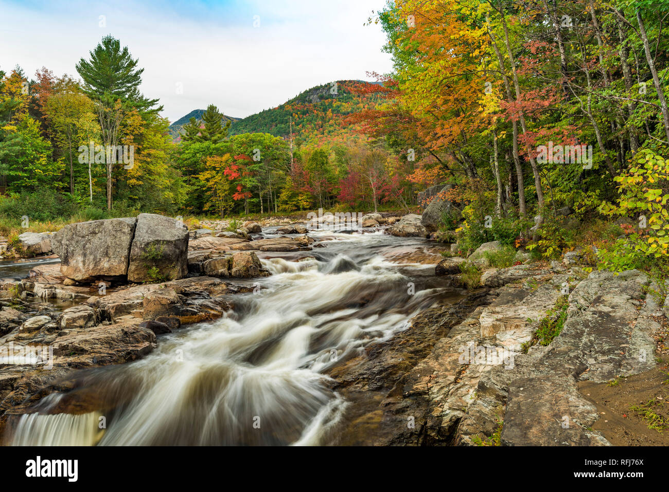 Little Whiteface Mountain rises over West Branch Ausable River at the rapids just above Wilmington Flume, Adirondack Mountains, Essex Co., NY Stock Photo