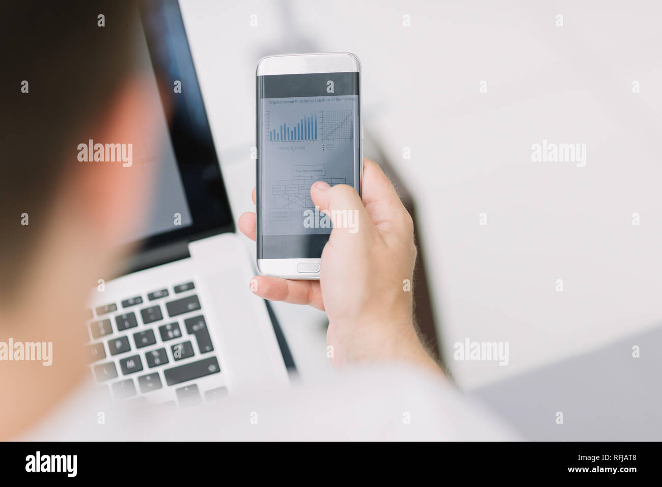 rear view. business men checking financial data Stock Photo