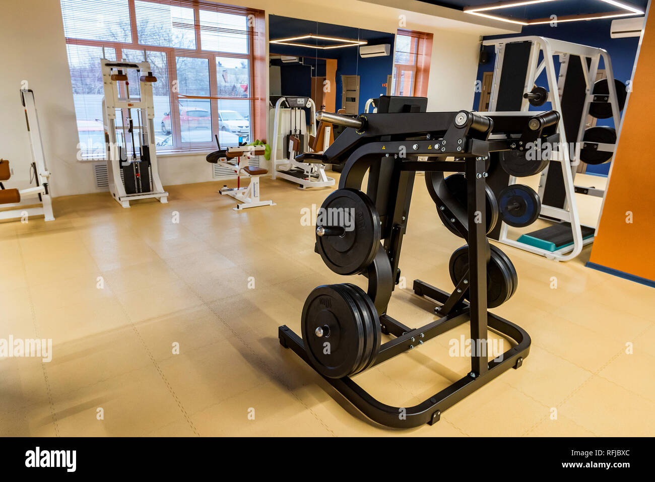 New fitness machines in modern gym interior Stock Photo