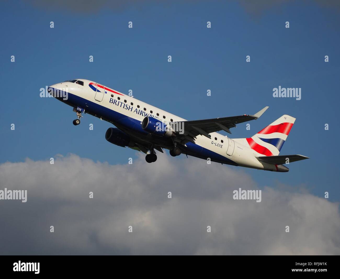 BA CityFlyer G-LCYE Embraer 170-175 takeoff from Polderbaan, Schiphol (AMS - EHAM) at sunset, pic. Stock Photo