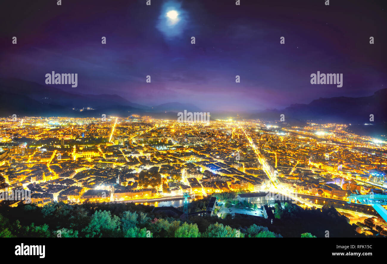 Aerial panorama view of Grenoble town at night. France Stock Photo