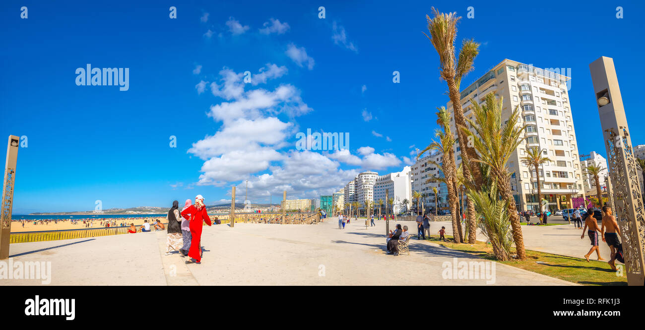 Panoramic view of beautiful seafront with modern apartment buildings and beaches with resting people. Tangier, Morocco, North Africa Stock Photo