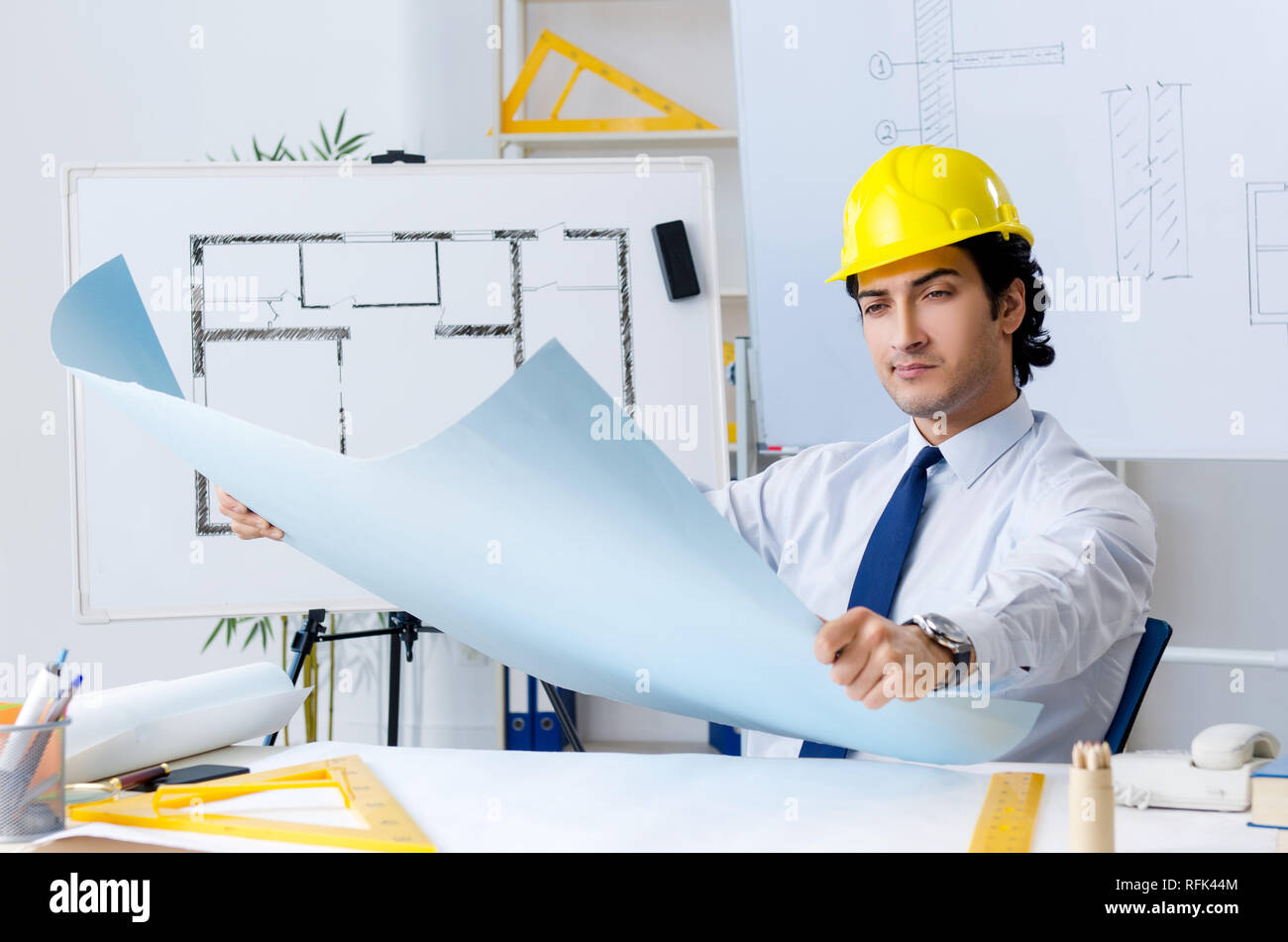 Young handsome architect working on the project Stock Photo