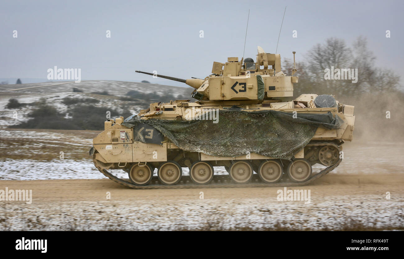 A U.S. Bradley Fighting Vehicle crew assigned to 2nd Battalion 5th Cavalry Regiment, 1st Armored Brigade Combat Team, 1st Cavalry Division conduct tactical maneuvers during the gunnery portion of Combined Resolve XI Phase II in Grafenwoehr, Germany Jan. 23, 2019. CBRXI Phase II is the culminating exercise for 1-1 CD's rotation in support of Atlantic Resolve, an enduring exercise that helps builds interoperability between U.S. Forces, their NATO allies and partners.  (U.S. Army National Guard photo by Sgt. 1st Class Ron Lee, 382nd Public Affairs Detachment, 1ABCT, 1CD released) Stock Photo