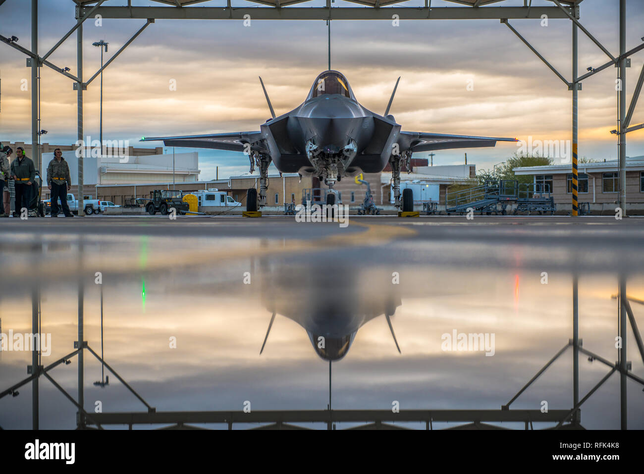 A pilot assigned to the 61st Fighter Squadron and 61st Aircraft Maintenance Unit crew chiefs prepare an F-35A Lightning II for taxi, Jan. 15, 2019 at Luke Air Force Base, Ariz. Crew chiefs work with pilots to ensure the F-35 takes-off and lands safely. (U.S Air Force photo by Airman 1st Class Jacob Wongwai) Stock Photo