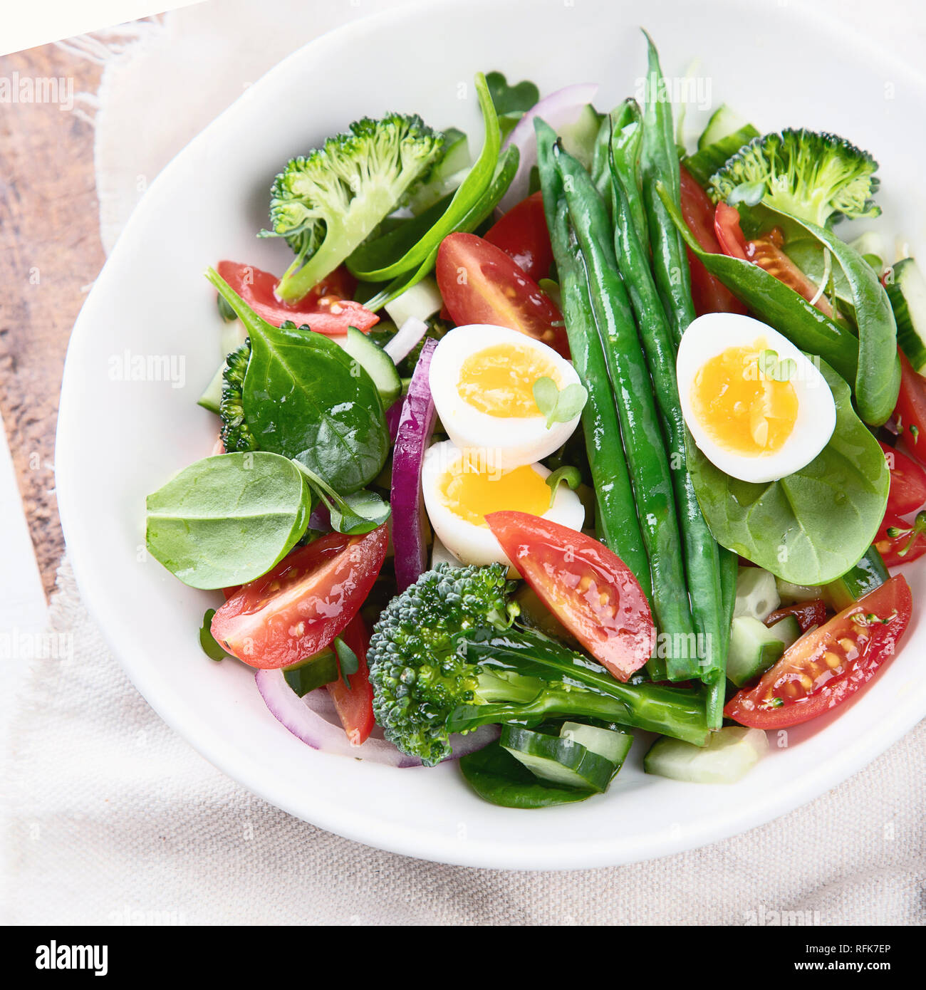Vegetables salad with eggs, green beans, broccoli and tomatoes. Diet
