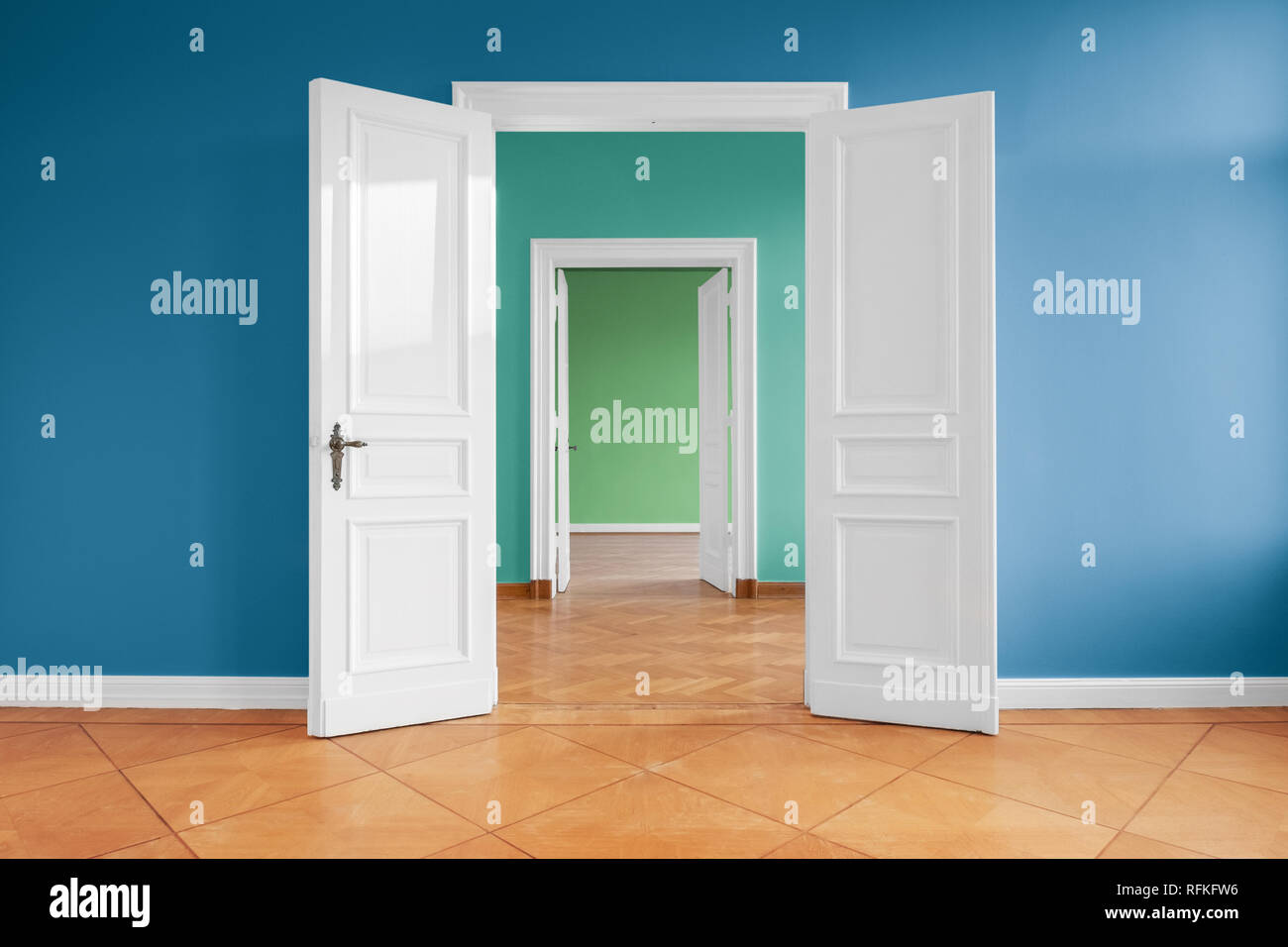open doors in empty apartment with colored walls Stock Photo