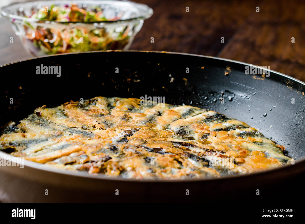 Fresh Fried Sardines / Anchovy Hamsi Tava in Pan on Wooden Surface