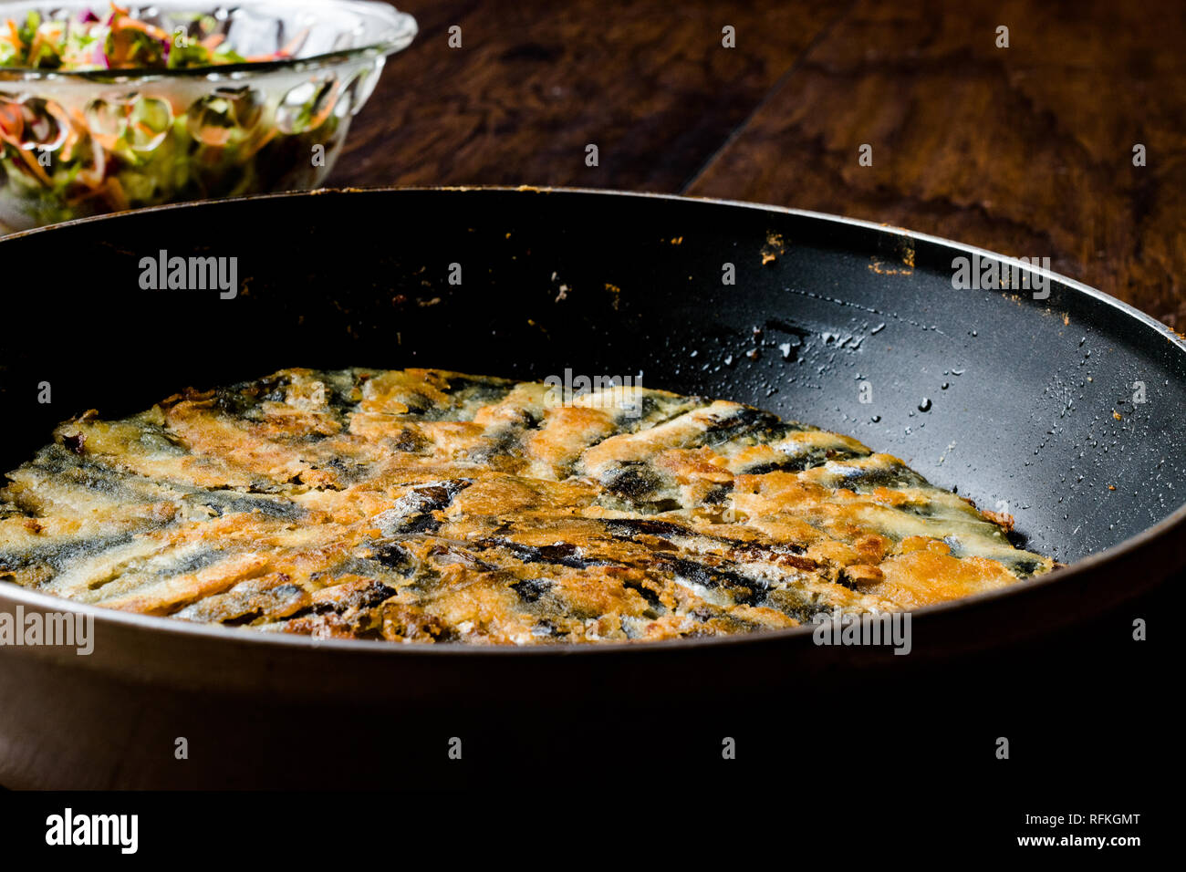 Fresh Fried Sardines / Anchovy Hamsi Tava in Pan on Wooden Surface