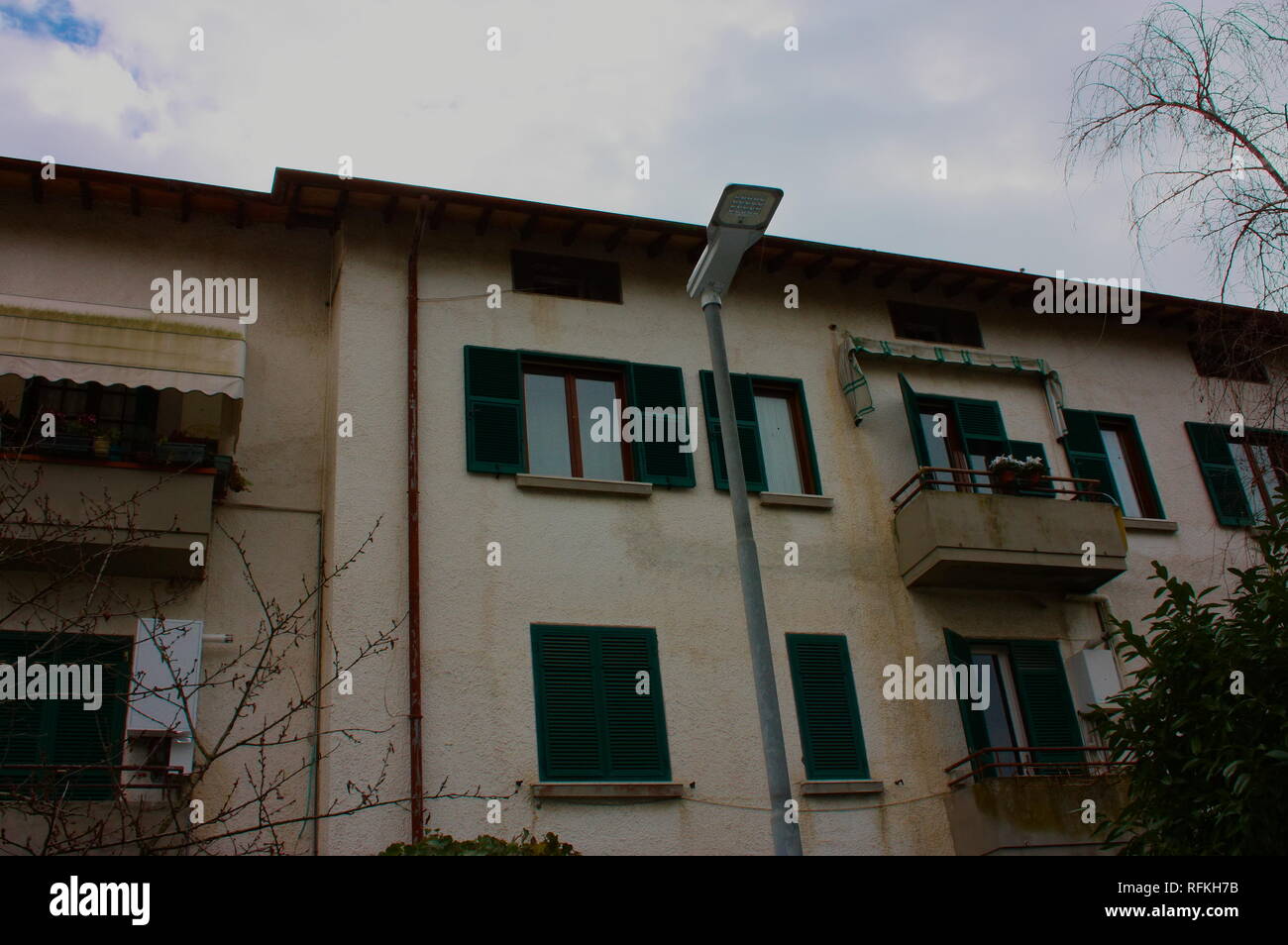 external facade of a house built in Italy. unknown Italian home. doors and windows. Stock Photo