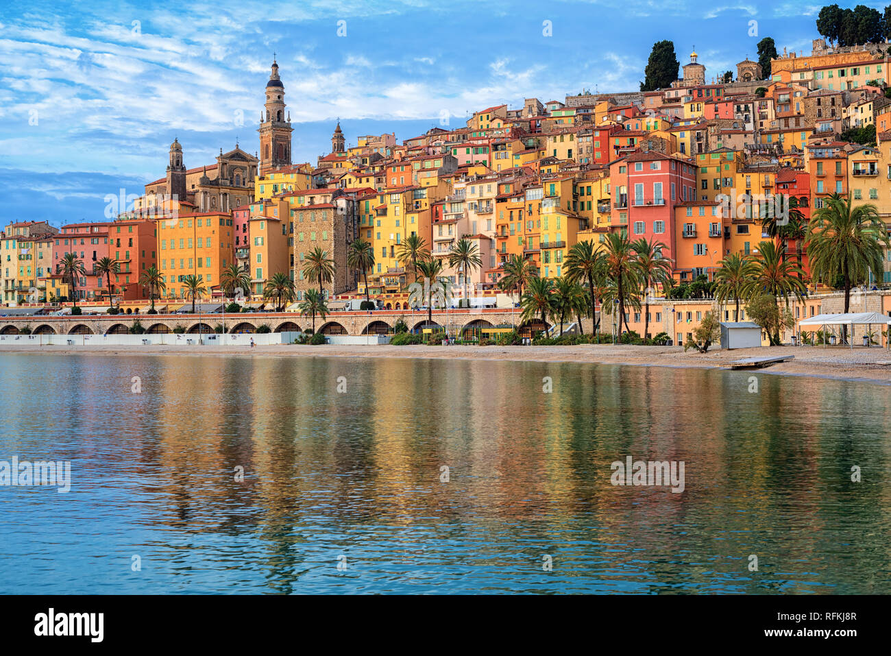 Colorful houses and sand beach in the historical Old Town Menton on