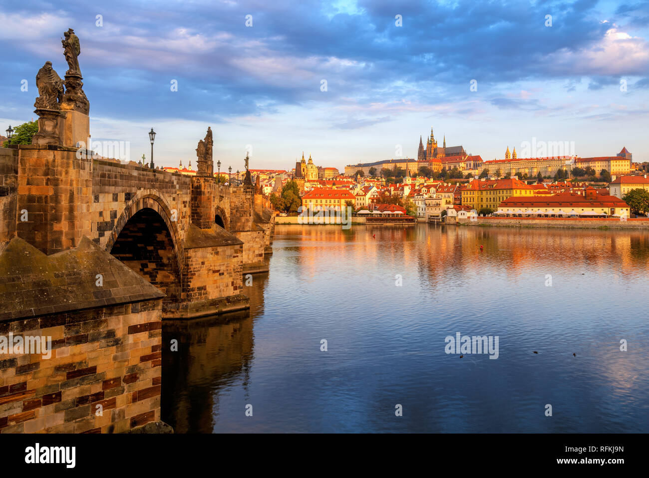Prague Old Town, Charles Bridge, St Vitus Cathedral and Prague Castle, Czech Republic, reflecting in Vltava river on sunrise Stock Photo