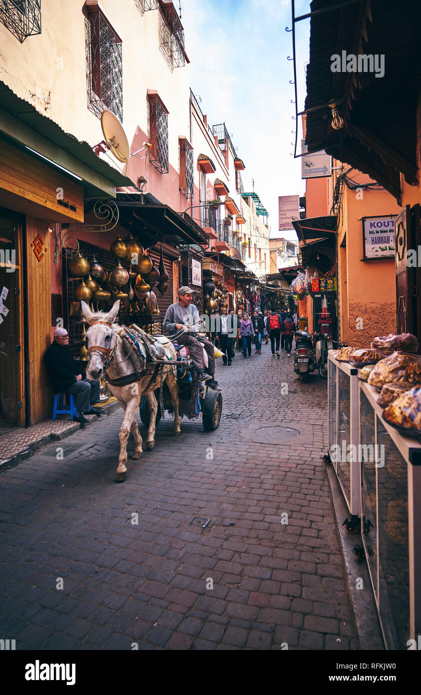 Scene of a traditional souk - bazaar - street of Marrakesh and Moroccan people, Morocco Stock Photo