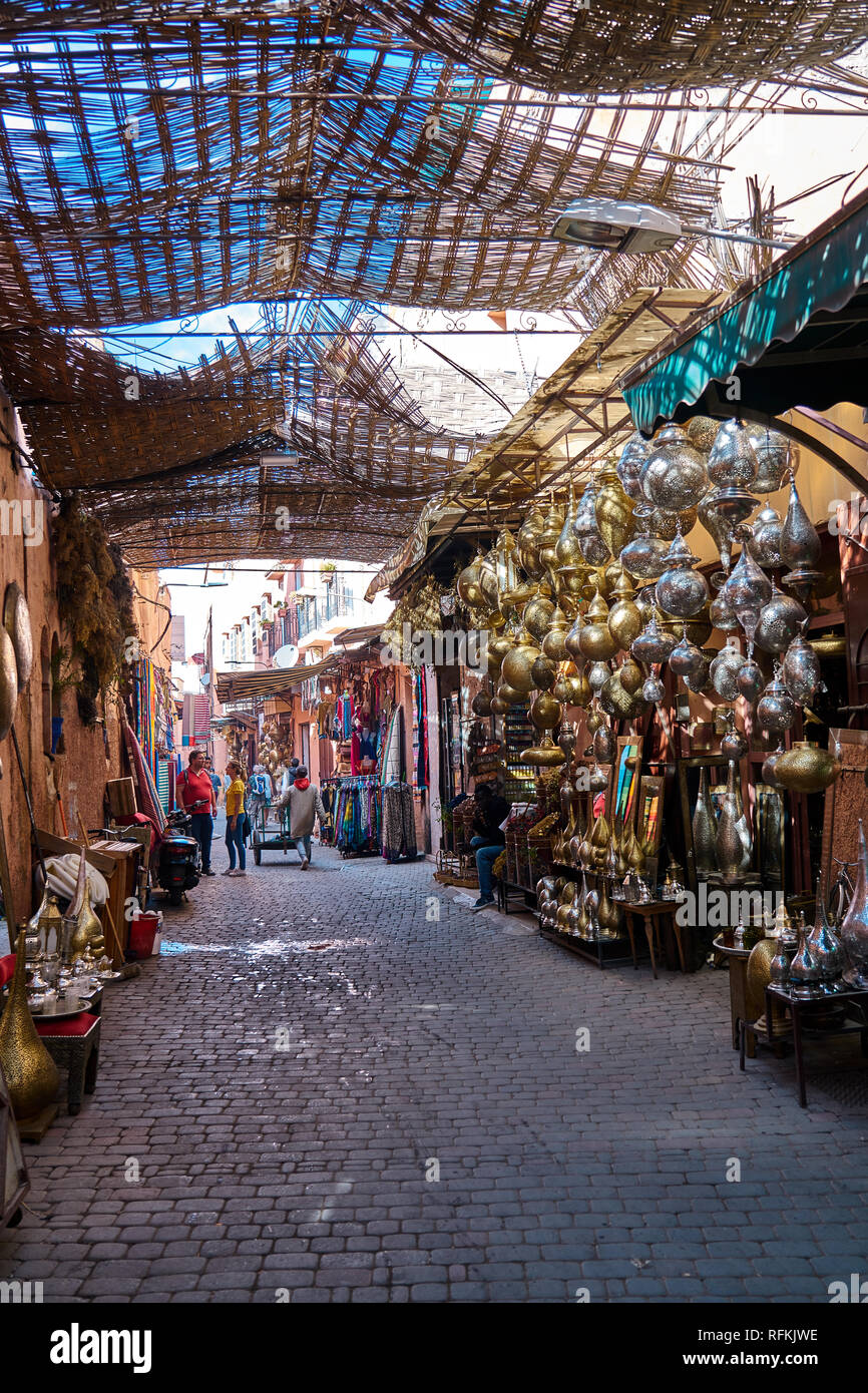 Scene of a traditional souk - bazaar - street of Marrakesh and Moroccan people, Morocco Stock Photo