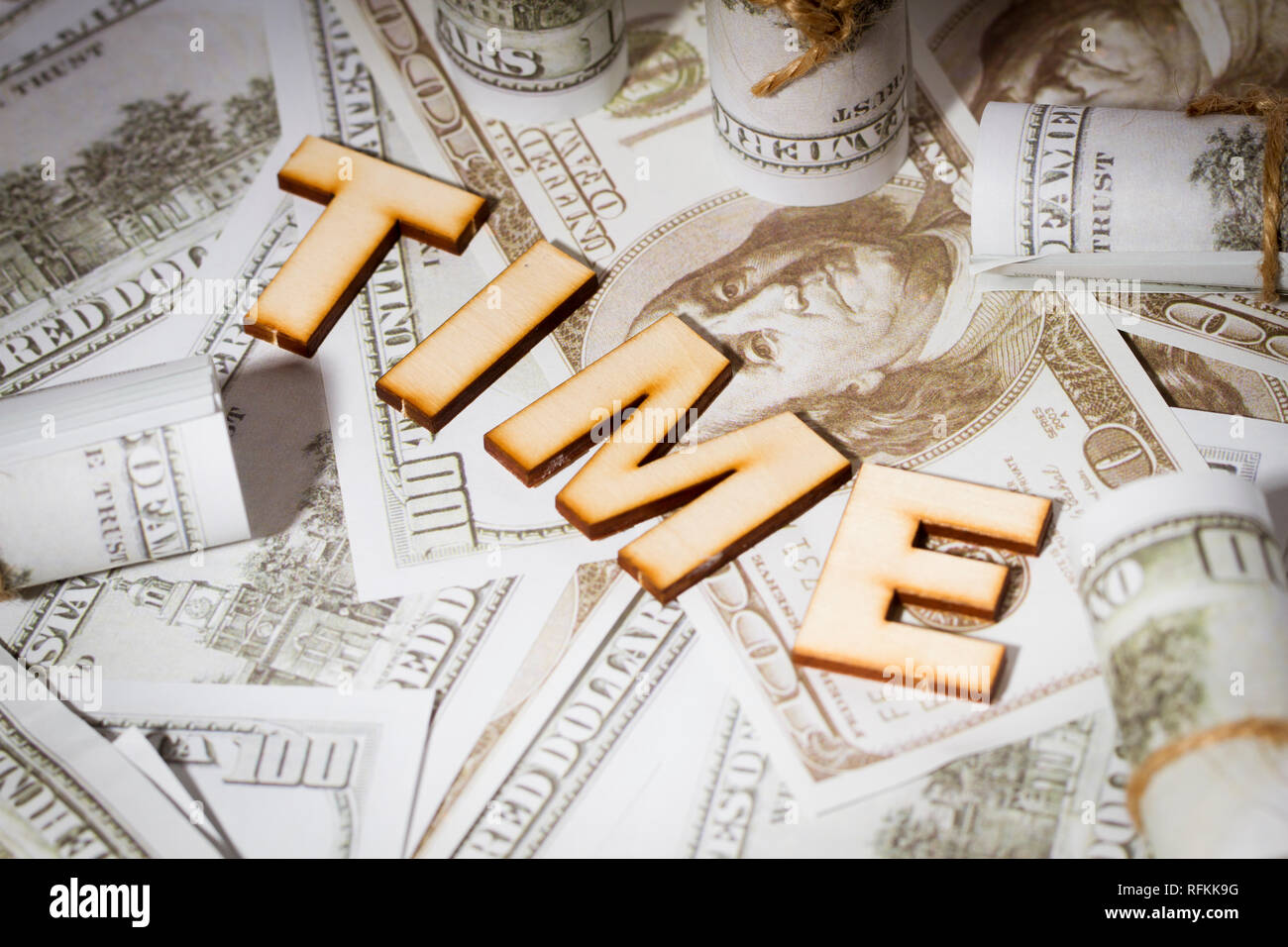 Time is money, dollar bills and time text Stock Photo - Alamy